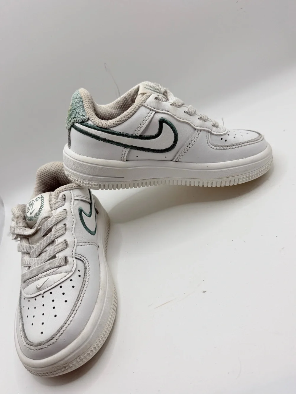 Nike White Kids Sneakers with Dark Green Swoosh